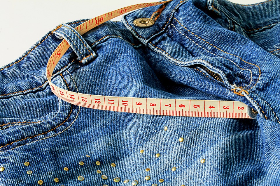 women's jeans and a tape measure for the tummy