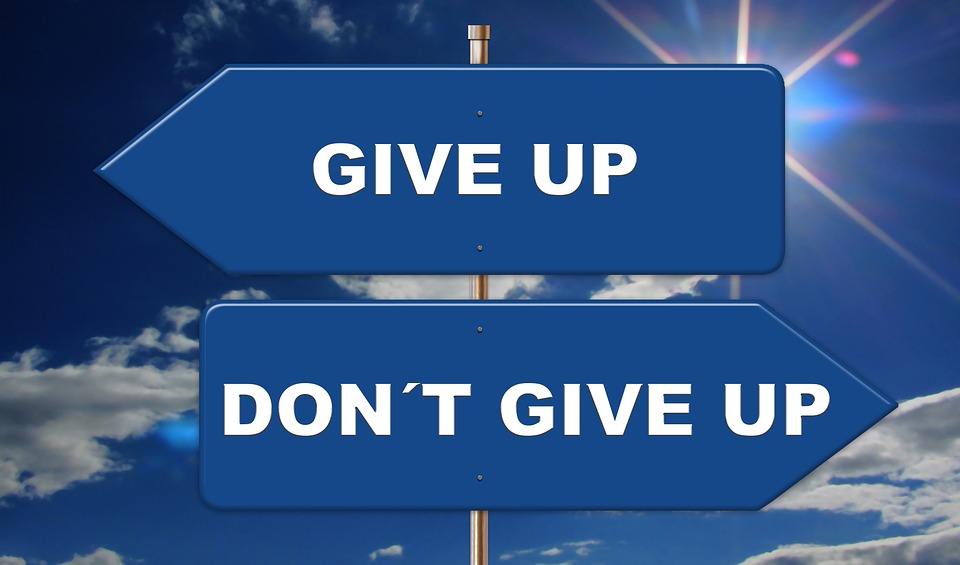 a sign of give up-don't give up to highlight the choice needed to Be Patient and Win